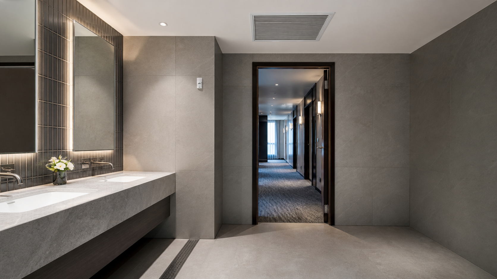 Typical odor-sensitive hospitality washroom and shared-facility environment